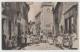 CARTE PHOTO - BOUCHERIE CHARCUTERIE " C. HUGON " - EPICERIE FINE - HORLOGER - RUES TRES ANIMEES D'UN VILLAGE A SITUER - - A Identifier