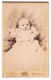 Fotografie C. Clark, Freiburg I. B., Portrait Baby In Weissem Taufkleid  - Anonyme Personen