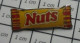 312c  Pin's Pins / Beau Et Rare / ALIMENTATION / BARRE CHOCOLAT NUTS NESTLE CONFISERIE - Alimentación