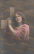 Postcard - 1920/30 - 9x14 Cm. | Fancy. Beautiful Woman Hugging The Cross. - Written In Greek On The Back. * - Femmes