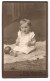Fotografie Max Wagler, Sachsenfeld I. S., Baby Mit Ball Auf Felldecke Sitzend  - Anonieme Personen
