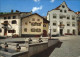 12456798 Scuol Tarasp Vulpera Dorfplatz Brunnen Scuol - Autres & Non Classés