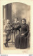 CARTE PHOTO NON IDENTIFIEE REPRESENTANT UNE FEMME ET DEUX ENFANTS POSANT DANS LE STUDIO PHOTO PINEAU A LIMOGES - To Identify