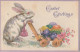 UR 17- " EASTER GREETINGS "- ( HEUREUSES  PAQUES ) - LAPINE POUSSANT UNE CARRIOLE D' OEUFS MULTICOLORES - Pasqua