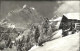 12019808 Braunwald GL Berghuette Winterpanorama Mit Ortstock Und Hoher Turm Brau - Sonstige & Ohne Zuordnung