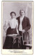 Fotografie Paul Hildebrandt, Königshütte, Tempelstr. 2, Portrait Eines Elegant Gekleideten Paares  - Anonyme Personen