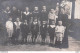 CARTE PHOTO GROUPE D'ENFANTS ET LA MAITRESSE LIEU NON IDENTIFIE - Te Identificeren