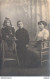 CARTE PHOTO NON IDENTIFIEE REPRESENTANT UNE FEMME ET DEUX ENFANTS POSANT DANS UN STUDIO PHOTO - A Identifier