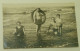 A Little Girl, A Fuller Girl With A Swim Ring, A Woman And A Man In Shallow Sea Water - Old Photo From 1929. - Personnes Anonymes