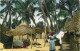 Afrique Noire - Femme Faisant Sécher Le Linge Au Mileu De Cases D'un Village Africain - Animée - Colorisée - Carte Dente - Unclassified