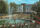 40 - Dax - Les Jardins Fleuris Et Le Jet D'Eau Avec L'Hotel Miradour - CPM - Voir Scans Recto-Verso - Dax