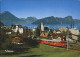 12053906 Vitznau Ortsansicht Mit Kirche Rigi Bahn Eisenbahn Buergenstock Stanser - Andere & Zonder Classificatie