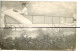 CARTE PHOTO. CPA .Surréalisme Photo Montage. SALIES DE BEARN .  Une Femme Qui Pilote  Un Avion . Antoinette - Photographs