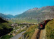 13604857 Andermatt Panorama Mit Eisenbahn Andermatt - Autres & Non Classés