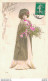 FEMME EN ROBE ET MANTEAU TENANT DES FLEURS - Women