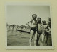 A Young Girl, A Boy And A Man On The Beach - Anonieme Personen