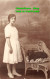 R419931 The Dog Is Sleeping In A Chair. Next To A Standing Woman In A White Dres - World