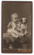 Fotografie Ludwig Mertens, Rendsburg, Junger Knabe Karlo Mit Stoffhund Im Atelier  - Anonyme Personen