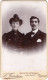 Photo CDV D'un Couple élégant Posant Dans Un Studio Photo A Voiron - Anciennes (Av. 1900)