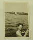 A Young Girl Is Swimming In A Lake - Personnes Anonymes