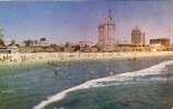 BATHING IN THE BEAUTIFUL PACIFIC COAST CLUB AS BACKGROUND,LONG BEACH.CALIFORNIA. - Long Beach