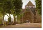 MOUTIER D´AHUN  - L´église Dominée Par Un Clocher Carré, Portail Orné De Personnages Sculptés - Moutier D'Ahun