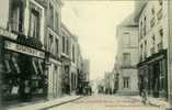 61 . MOULINS LA- MARCHE LA GRANDE- RUE  ,  ET COMMERCES . - Moulins La Marche