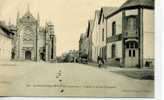 CPA...DE ST JULIEN DE VOUVANTES...ANIMEE...AVEC CYCLISTE...ET TACOT...LA RUE PRINCIPALE ET L'EGLISE... - Saint Julien De Vouvantes