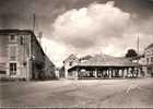 CPSM.  CHARROUX VIEILLES HALLES ET ROUTE DE CIVRAY. DENTELLEE. - Charroux