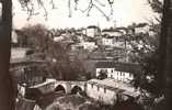 CPA.  TREIGNAC  PAR MICHEL. VIEUX PONT ET VUE DE LA COTE. DENTELLEE. - Treignac