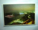 Niagara Falls, At Night. This View From The Maple Leaf Tower Shows Both Falls, The Mnolta Tower And The Skylon - Niagara Falls