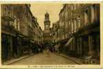 Delcampe - CPA...VIRE...ANIMEE...AVEC COMMERCES...RUE SAULNERIE ET LA PORTE DE L'HORLOGE... - Vire