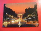 CPM OU CPSM -(75 PARIS)- L´AVENUE DES CHAMPS-ELYSEES ET L´ARC DE TRIOMPHE DE L´ETOILE ILLUMINES- - Parigi By Night