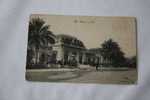 1910 - 06  NICE DEVANT DE GARE ET TAXI ATTELAGES A CHEVAUX CHEVAL  BORDEE DE PALMIERS ALPES MARITIMES - Ferrovie – Stazione