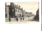 CPA PONTORSON L'hotel De L'ouest Et La Grande Rue ,(très Animée) - Pontorson