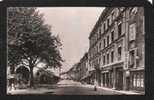 CPA 38 ISERE CREMIEU LES HALLES ET RUE LIEUTENANT-COLONEL BET REAL PHOTO CARTE POSTALE FRANCAISE - Crémieu