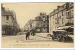 Carte Postale Ancienne La Délivrande - La Grande Rue Et La Place - Automobile - La Delivrande