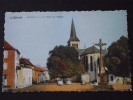 MANZAT (Puy-de-Dôme) - La Place De L'Eglise - Calvaire - Commerce - Non Voyagée - Ed. "La Cigogne" - Manzat