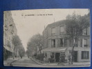 CPA....LA GARENNE..LA RUE DE LA POSTE..CAFE DE PARIS...1914....2 PHOTOS - La Garenne Colombes