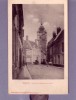 59 - Bergues - La Rue Du Collège Et Le Beffroi - Editeur: Patoor - Bergues