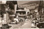 MK /  CPSM 9X14 . AUTRICHE . HOHENLUFKURORT SAALBACH 1003m. DORFSTRASSE . Hôtel  BAUER . Femmes En Costume  Folklorique - Autres & Non Classés