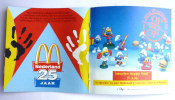 FIGURINE SCHTROUMPF MC DONALD'S 25 Ans LIVRET PUBLICITAIRE HOLLANDAIS AVEC PHOTO SERIE DE 1996 - Schtroumpfs