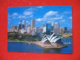 OPERA HOUSE WITH SYDNEY"S EVER CHANGING SKYLINE AND BOTANICAL GARDENS AS A BACKGROUND - Sydney