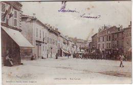 54. LONGUYON. RUE CARNOT. BELLE ANIMATION. DEFILE DU 14 JUILLET Ou GREVE Ou ??? Editeur  A.NAUDIN - Longuyon