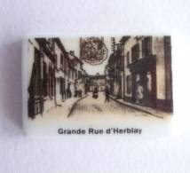 FEVE PUBLICITAIRE PERSO DH - HERBLAY 95 - GRANDE RUE GENRE CARTE POSTALE ANCIENNE - Regiones