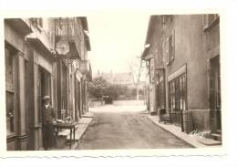 87 -  CHATEAUPONSAC  -  La Grande Rue   - CPSM - Le Commerçant Est Sur Le Pas De Sa Boutique - Enseigne - Chalus