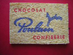 PETITE EPONGE ( COMPRESSEE N´A PAS ENCORE ETE MOUILLEE) CHOCOLAT POULAIN CONFISERIE - Chocolade