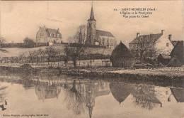 (59) SAINT MOMELIN. L'Eglise Et Le Presbytere Vue Prise Du Canal Ed. Baurain - Otros Municipios