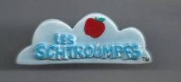 Fève : Logo : Les Schtroumpfs. (Voir Commentaires) - Strip