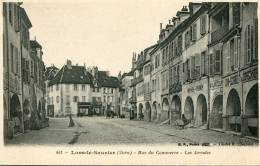 CPA 39 LONS LE SAUNIER RUE DU COMMERCE LES ARCADES - Lons Le Saunier